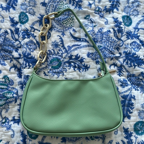 Mint green hand bag with chain handle. Has a card holder and one pocket inside. - Picture 1 of 3